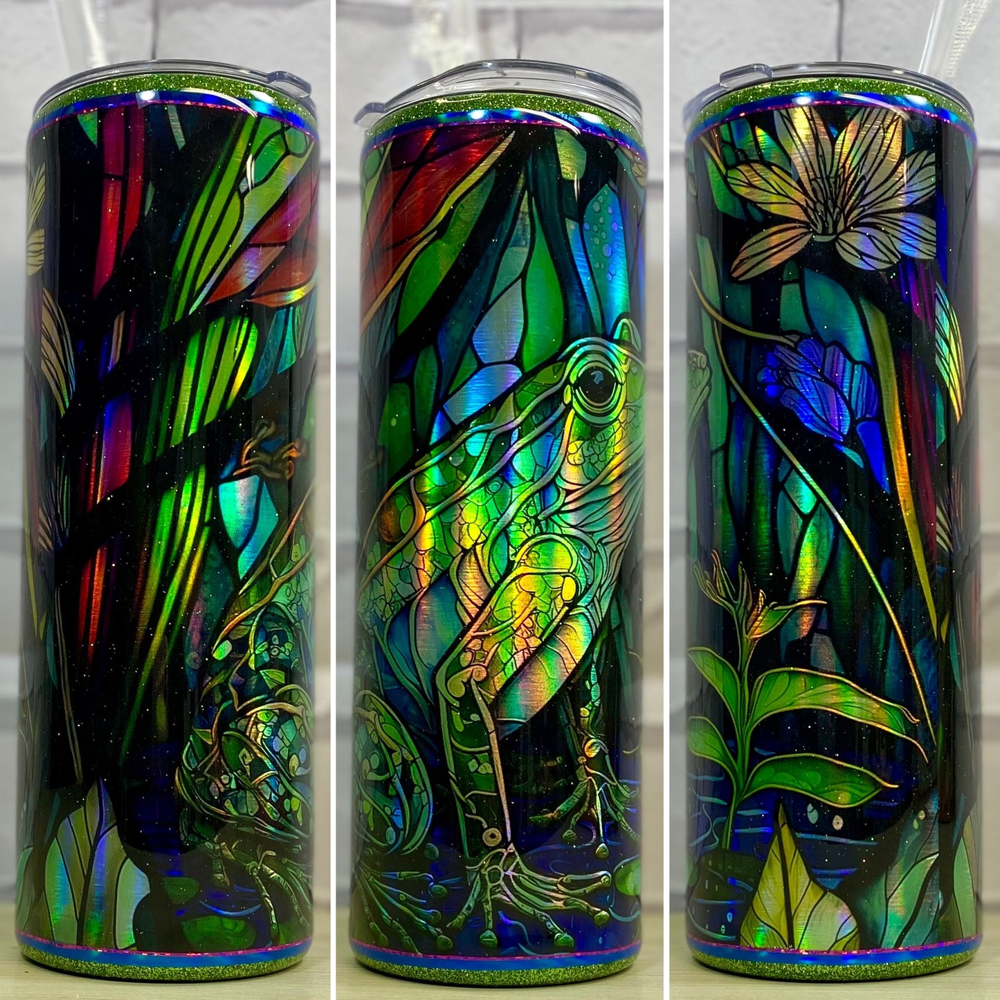 A stainless steel tumbler featuring a frog in a pond surrounded by flowers and greenery on a blue and green holographic background.