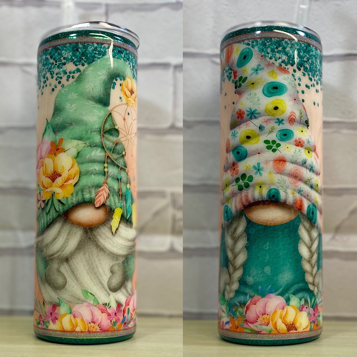 A stainless steel tumbler with a colorful gnome design on each side.