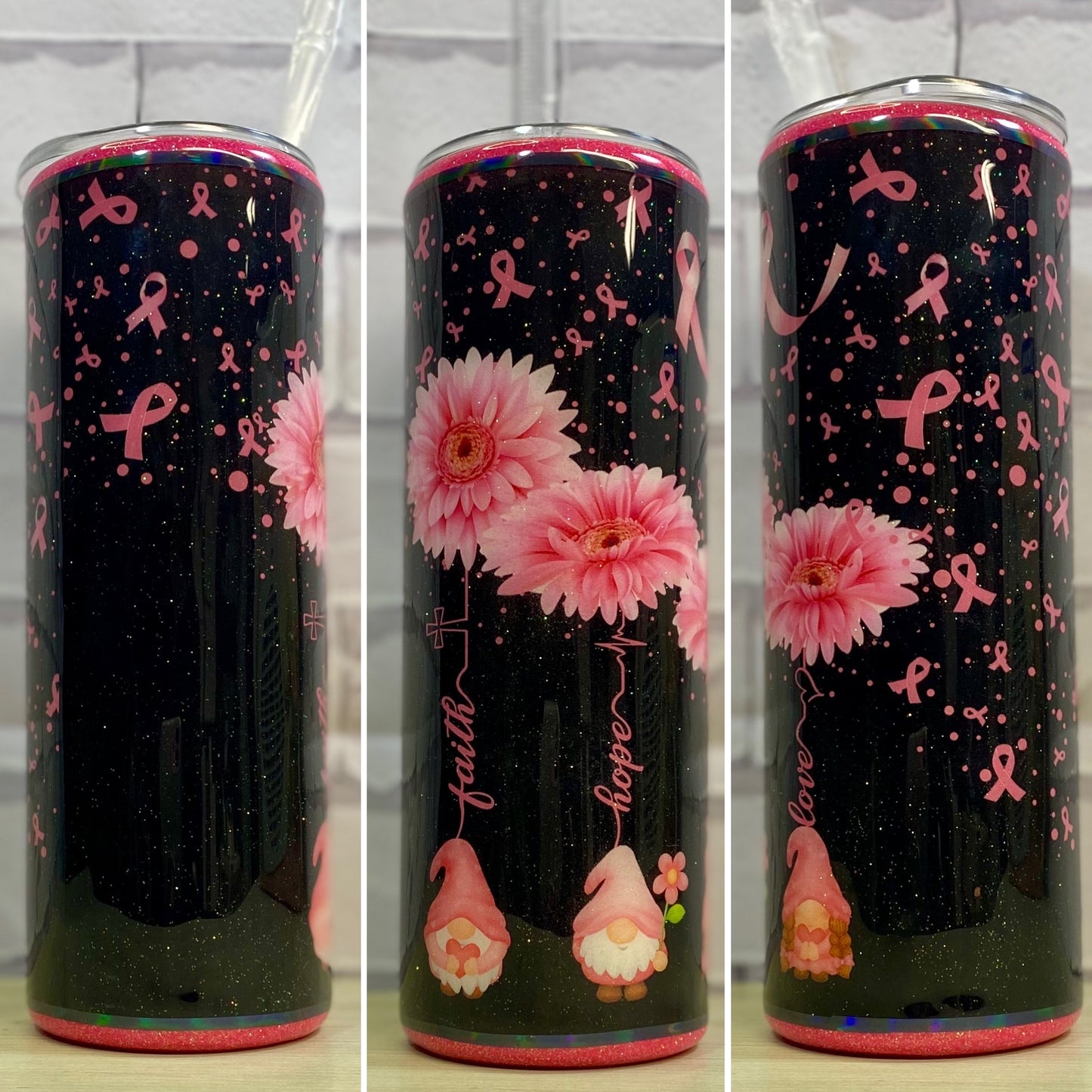 A black and pink glittered stainless steel tumbler with gnomes, daisies and pink ribbons.