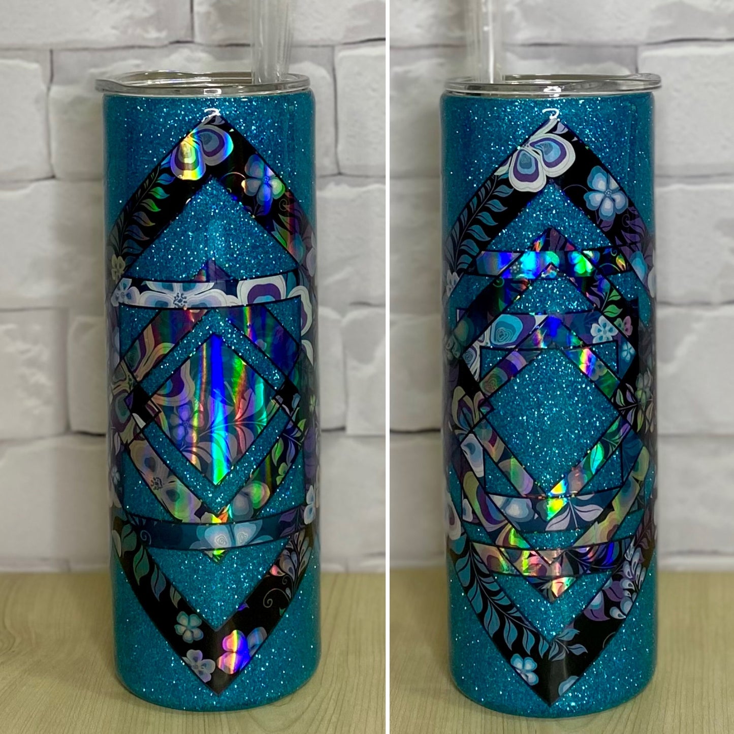 A stainless steel tumbler with a geometric blue design