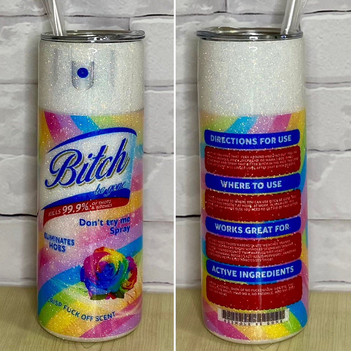 A white gittered tumbler with a bright design that says bitch.