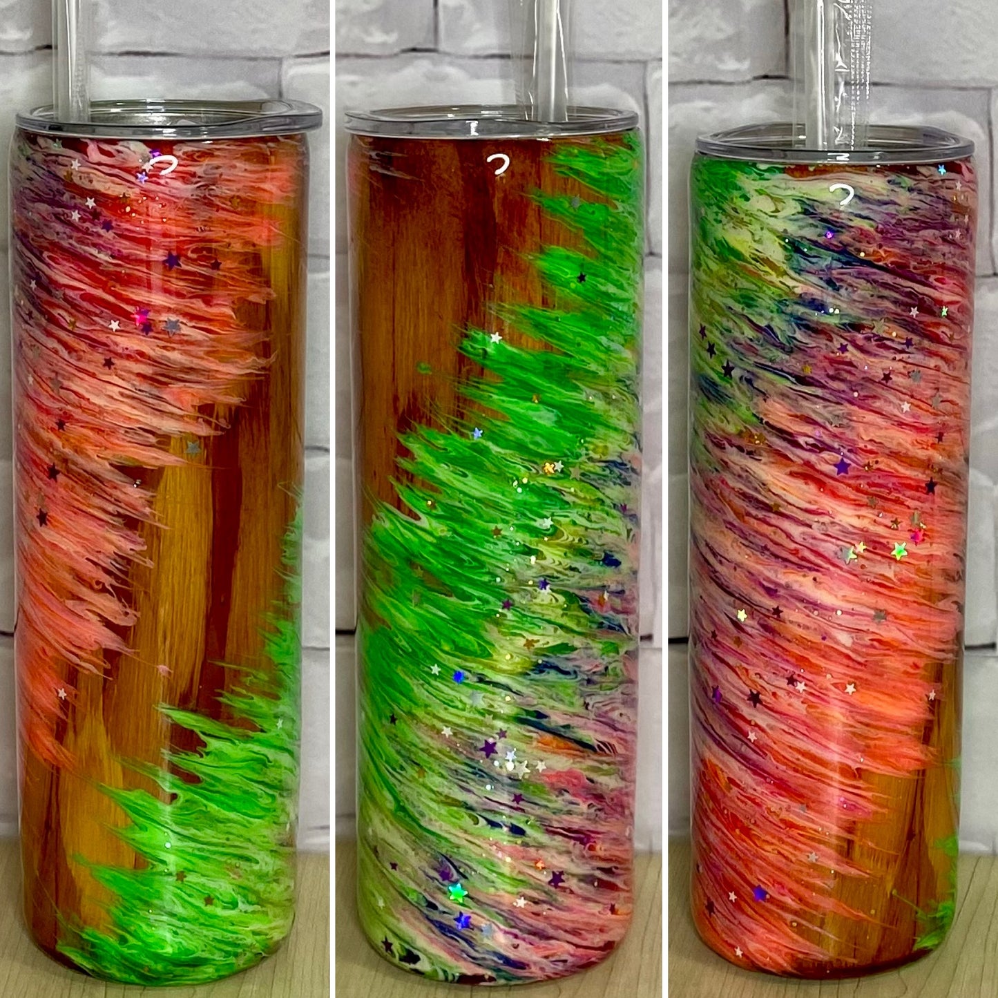 A woodgrain tumbler with a feathered ink design and a few random sprinkles of glitter.